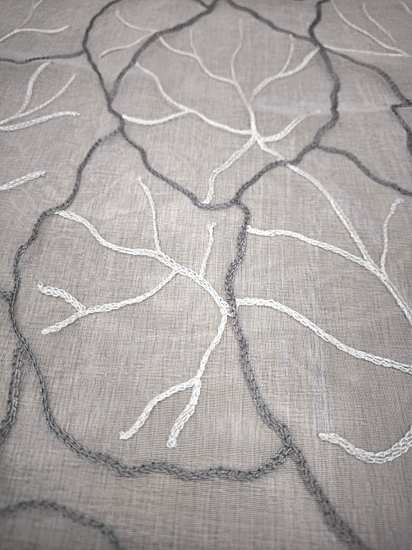 Particola del tessuto bianco/grigio