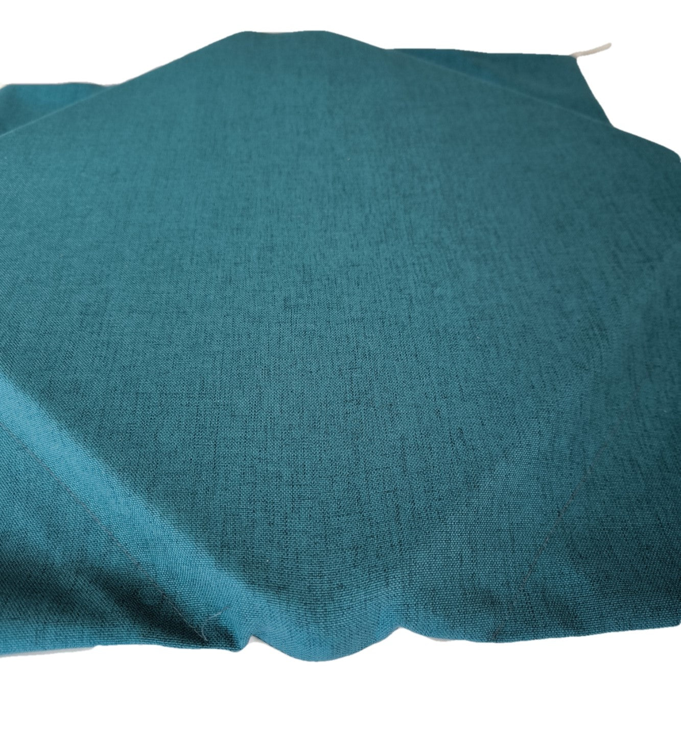 Primo piano del cuscino ottanio, tessuto effetto cotone morbido e resistente.