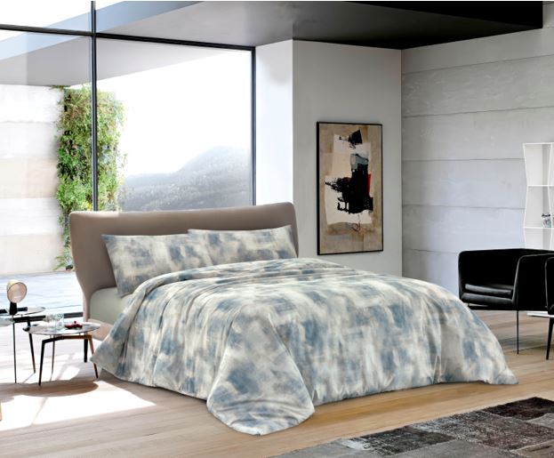 Copripiumino ottanio sfumato su letto, set biancheria da letto elegante