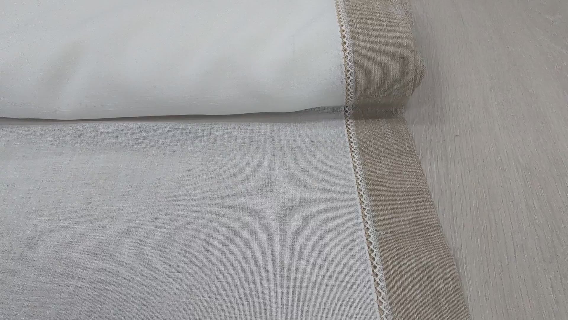 Video panoramico del tessuto effetto lino bianco naturale con bordo corda e crochetta